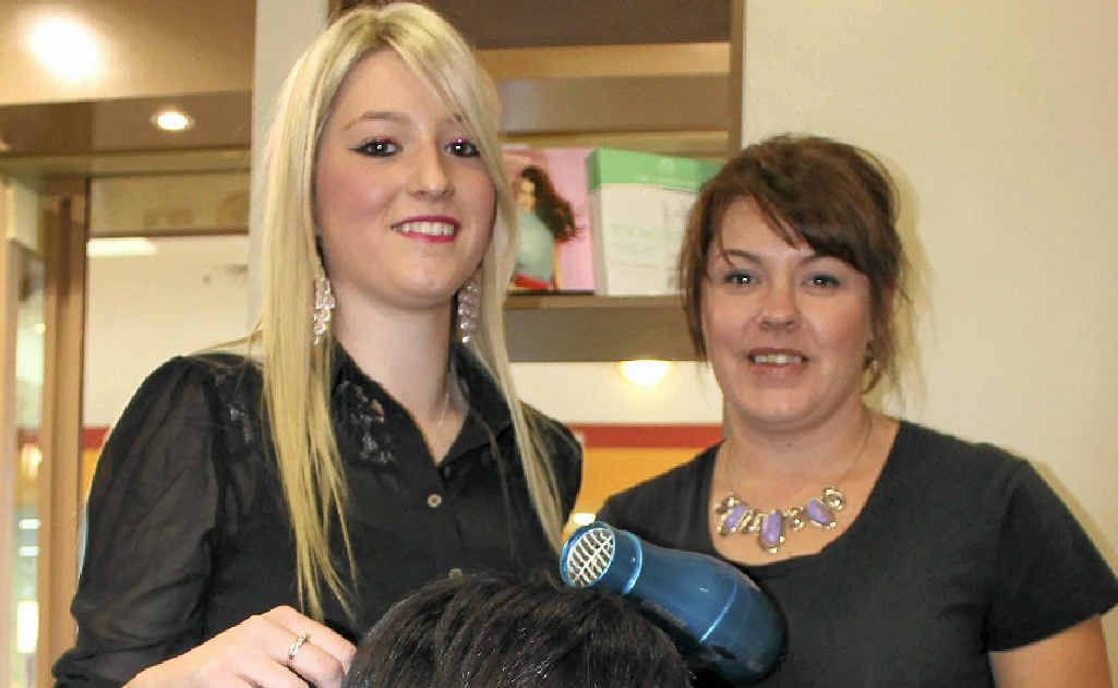 New apprentice Charlotte Hockings (left) puts salon owner Clare Jeffries in the hot seat, while apprentice co-ordinator Raylee Wilson supervises.